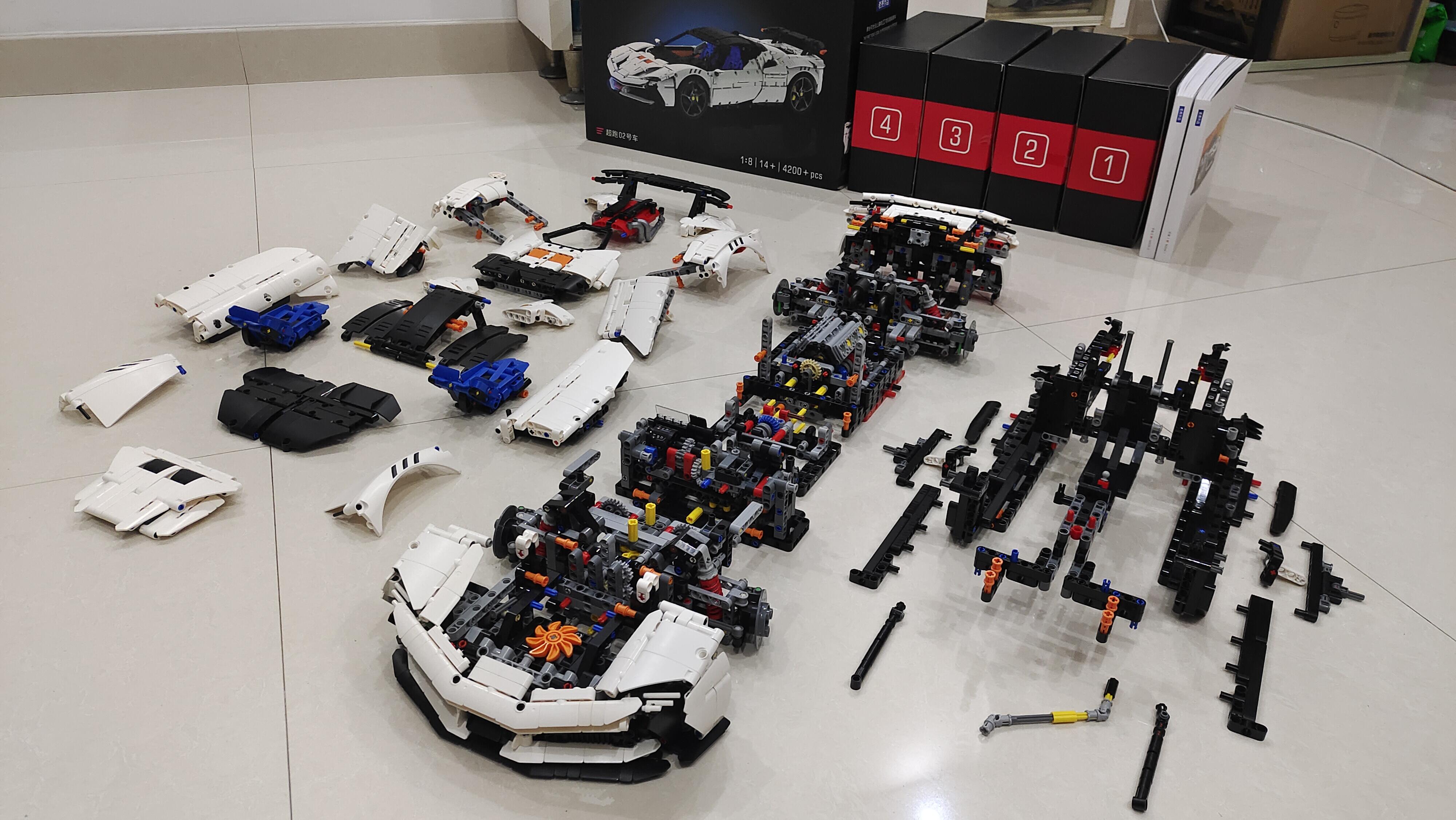 MOC 02 packaging next to the four numbered build bags and all parts laid out on the floor