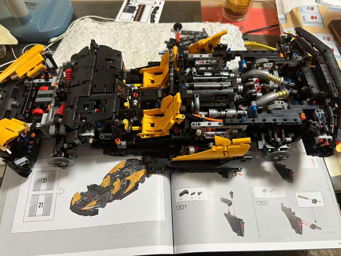Manual showing exterior panel sequence next to the yellow MOC 03 with interior frame