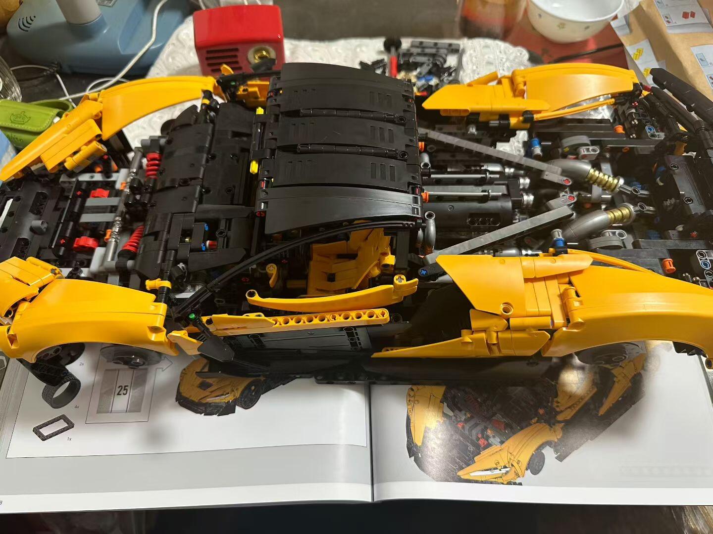 Final-stage bodywork pages next to the yellow MOC 03 with side and rear panels installed