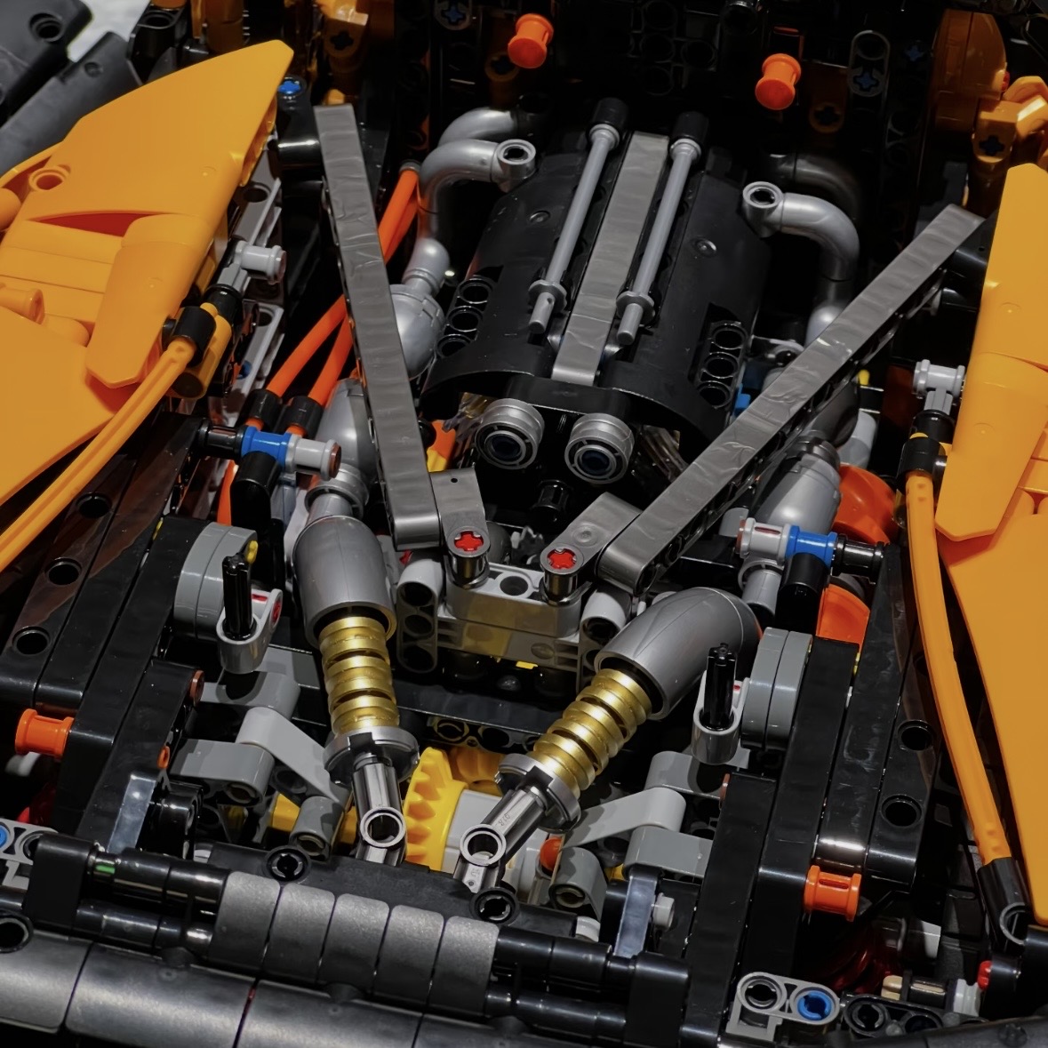 MOC 03 engine bay close-up showing V8, twin shock absorbers and exhaust manifolds