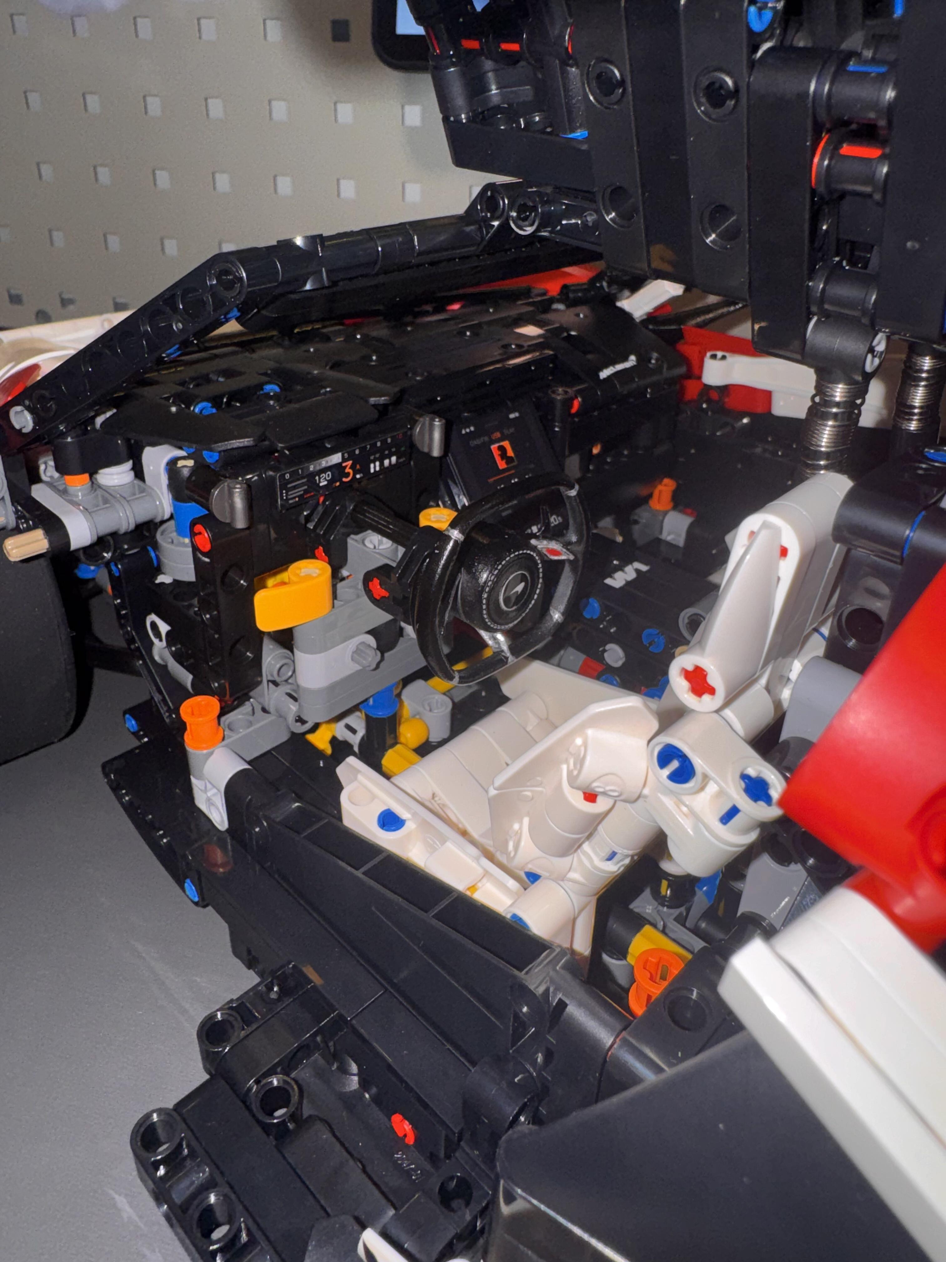 Race livery MOC 03 cockpit close-up with race steering wheel and white interior trim